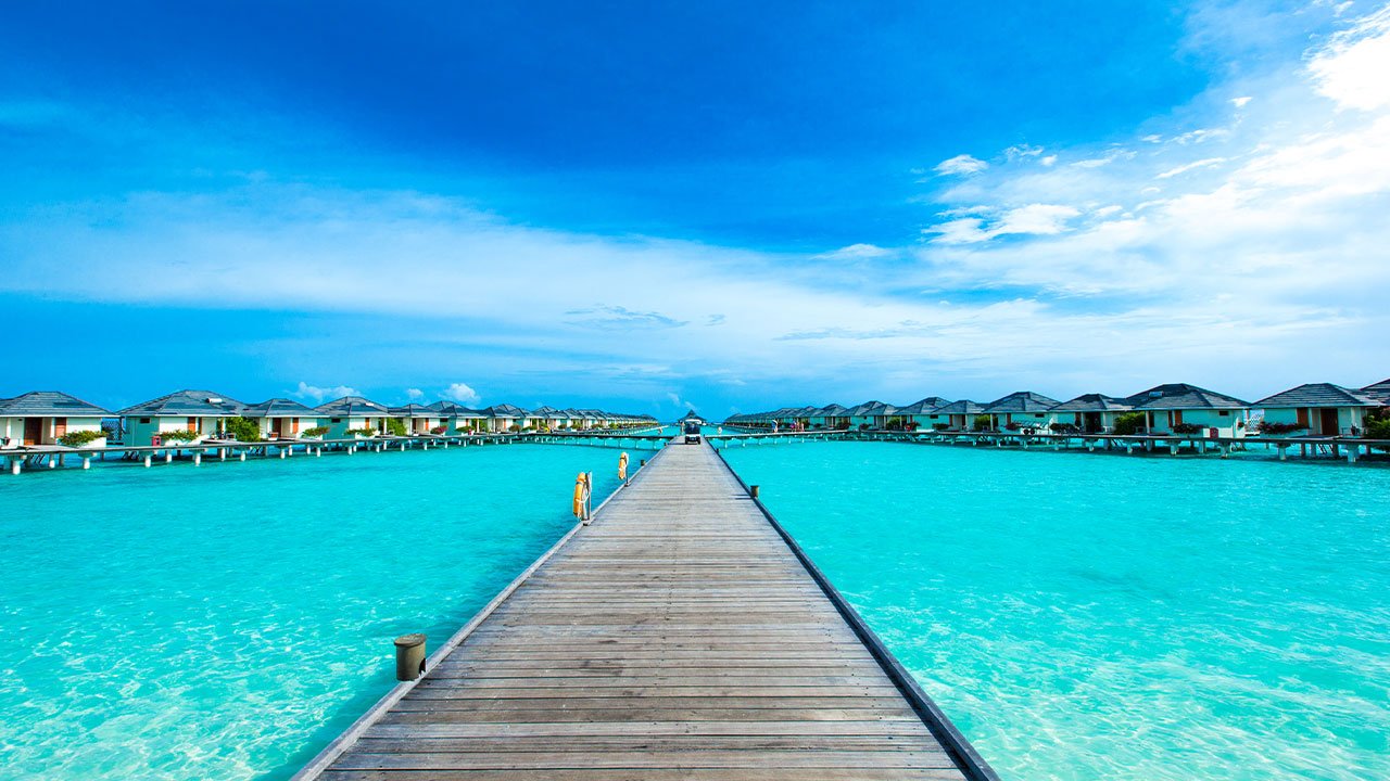 Wooden pier over turquoise water